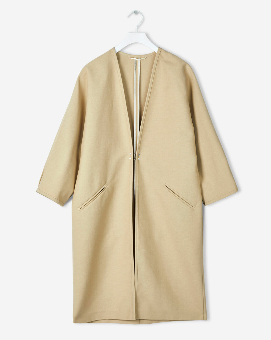 Beige kraglös kappa från Filippa K