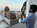 Prins Carl Philip fotograferar utsikten från Villa San Michele på Capri.