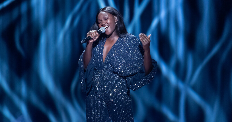 Faith Kakembo slog igenom i "P4 Nästa" med låten "Through Fire And Rain". Nu tävlar hon än en gång i Melodifestivalen.