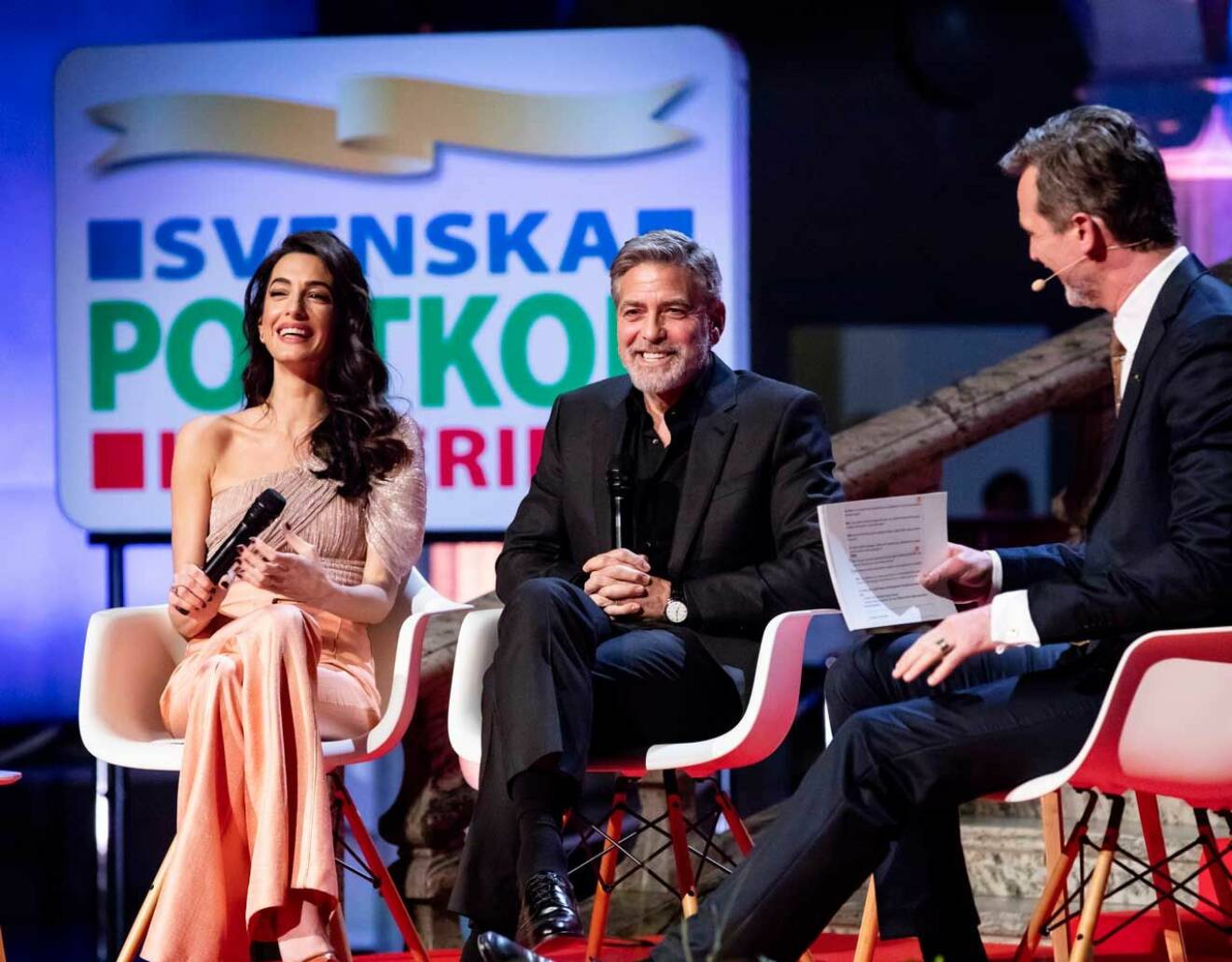 George och Amal Clooney i Stockholm med Postkodlotteriets Rickard Sjöberg.