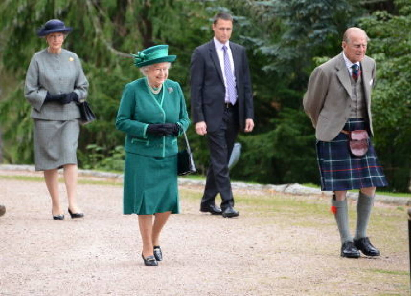 Queen Elizabeth II and Prince Philip, Duke of Edinburgh were introduced to a parishioner during their walkabout after morning service at Crathie Church in Aberdeenshire