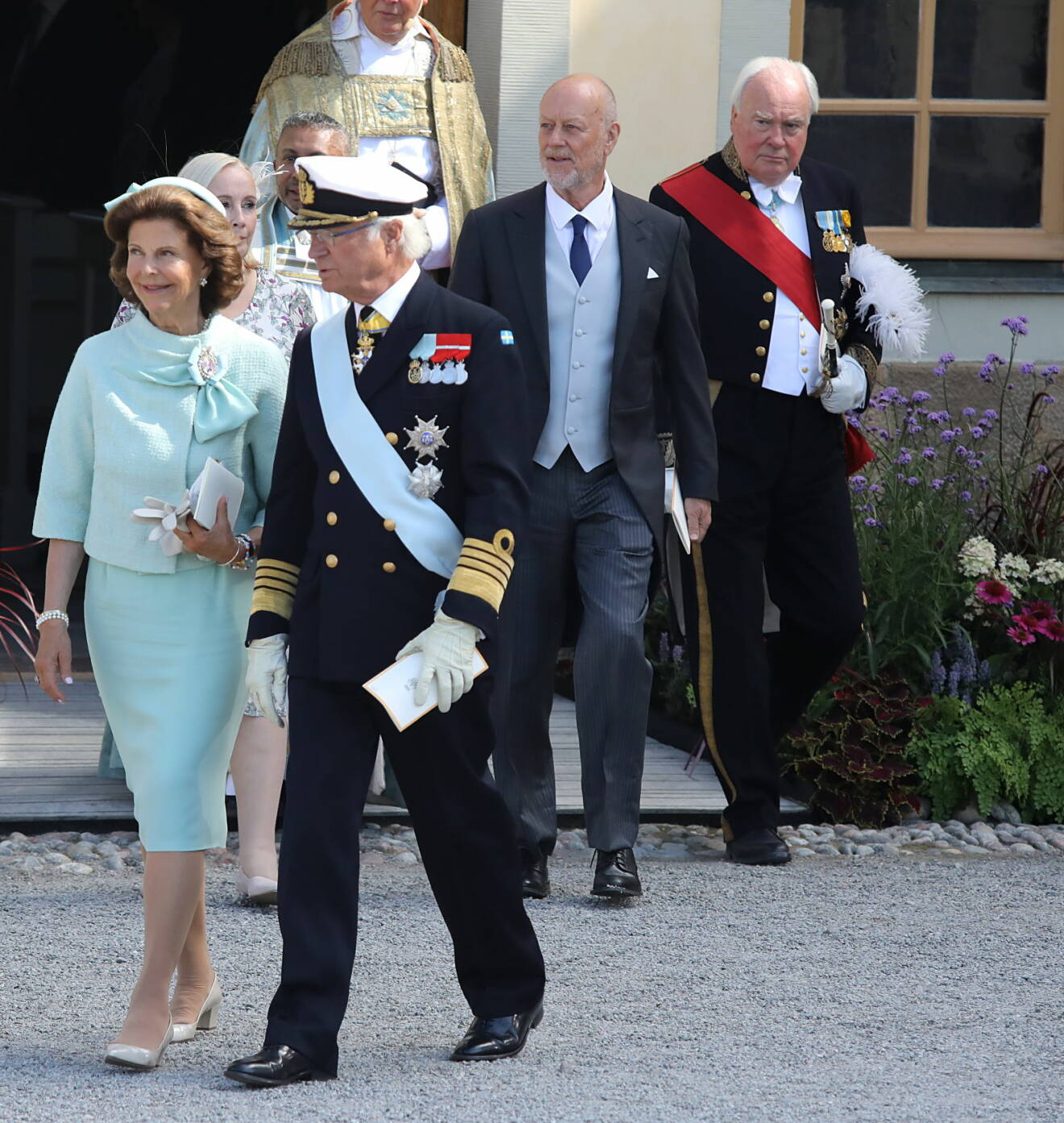 Överceremonimästare Johan Molander mred kungen och drottningen vid prins Julians dop