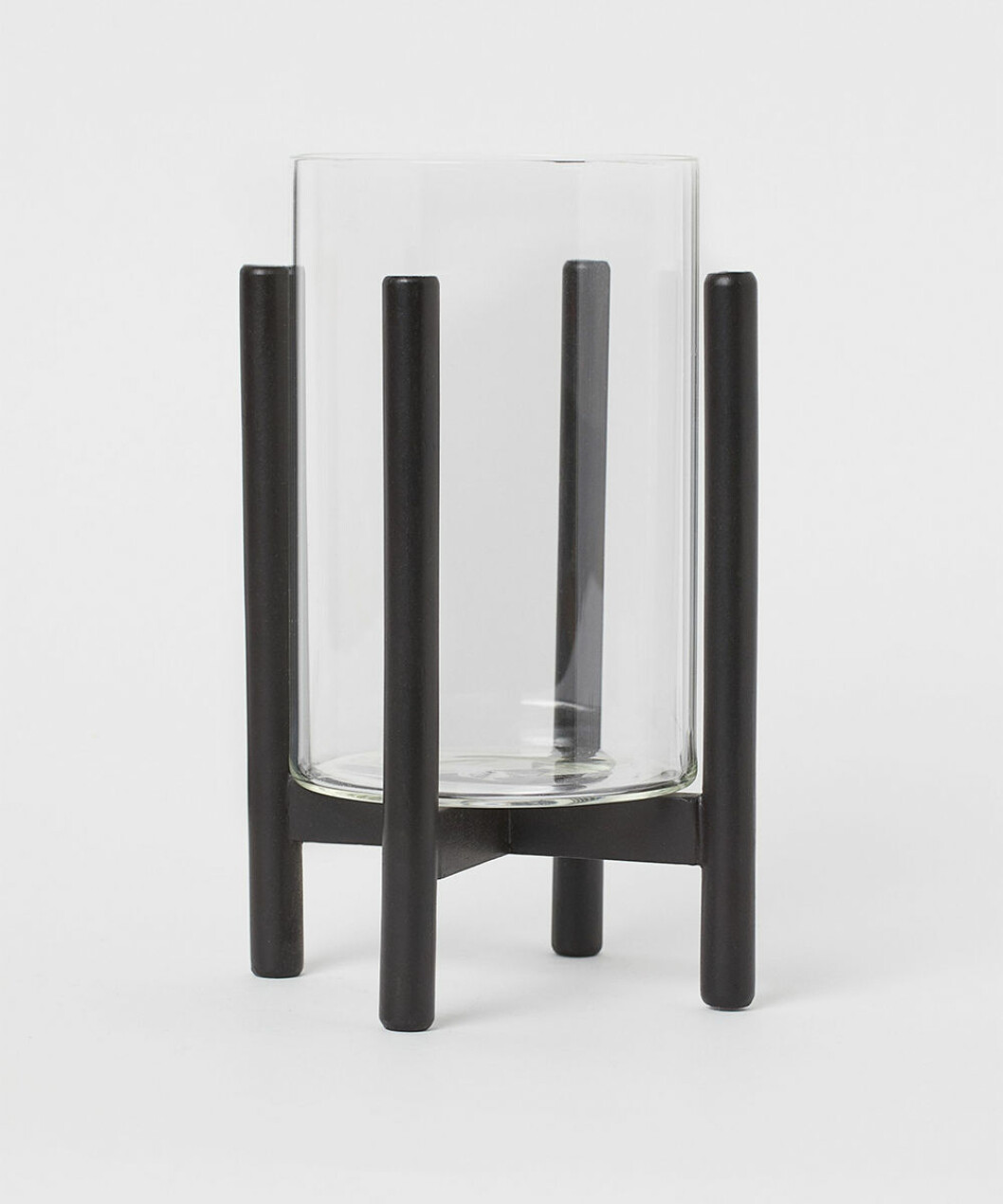 Ljuslykta i glas på stativ