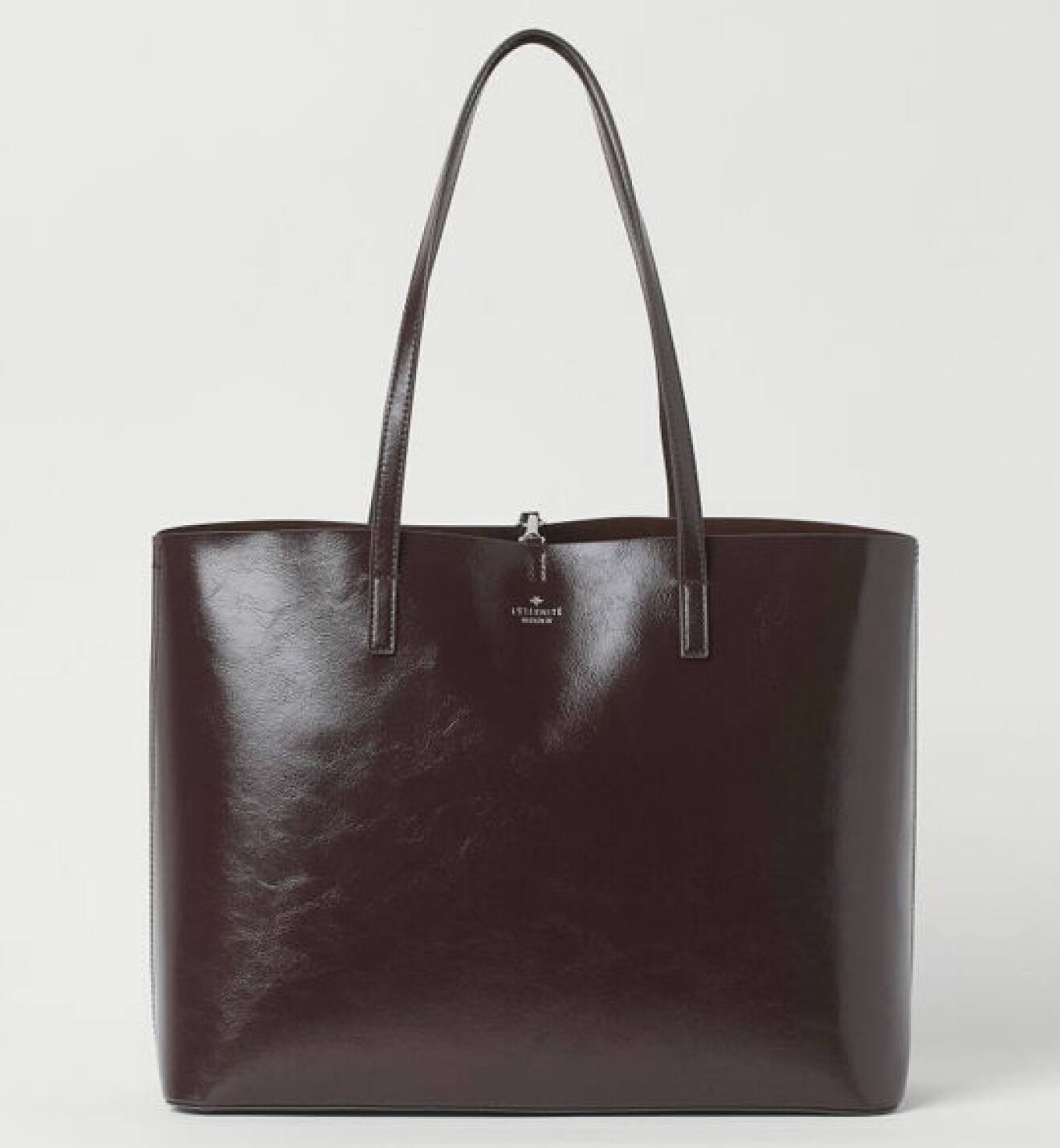 mörkbrun väska som liknar Hermes Kelly från H&amp;M
