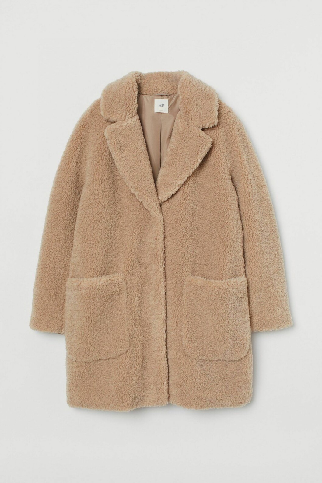 Pilekappa i beige