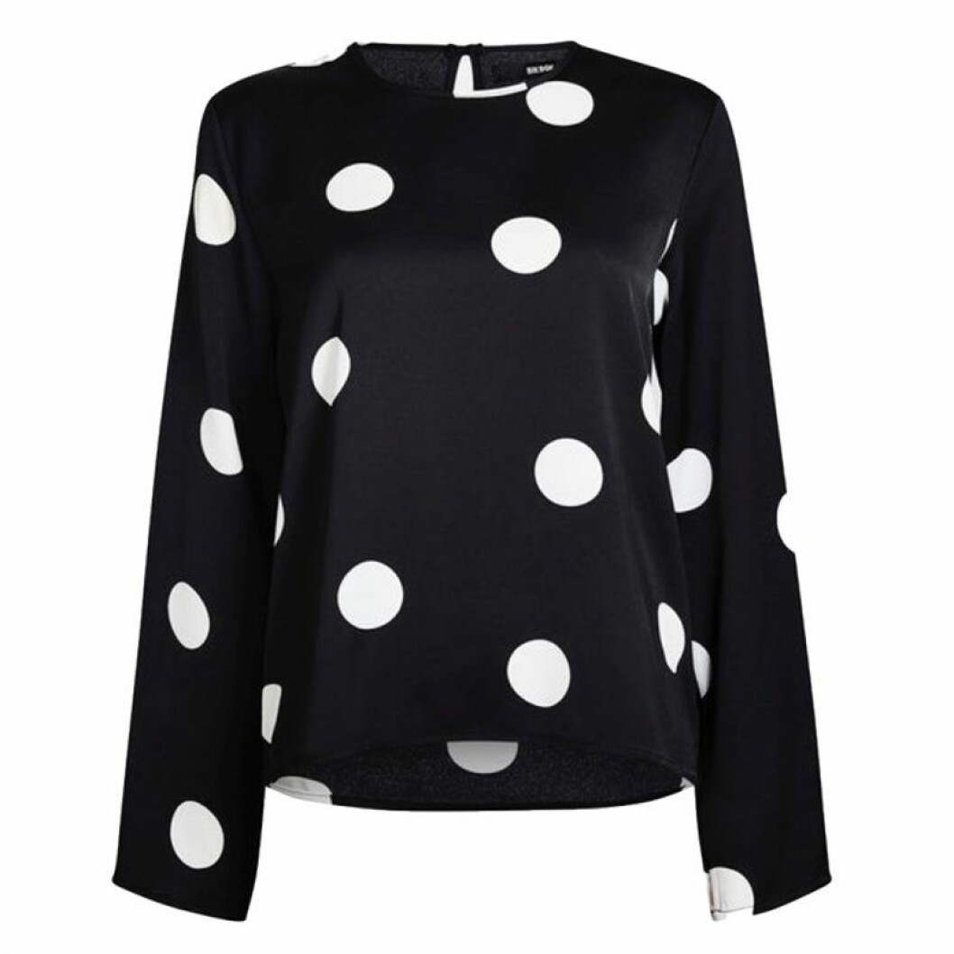 Prickig blus i glansigt material
