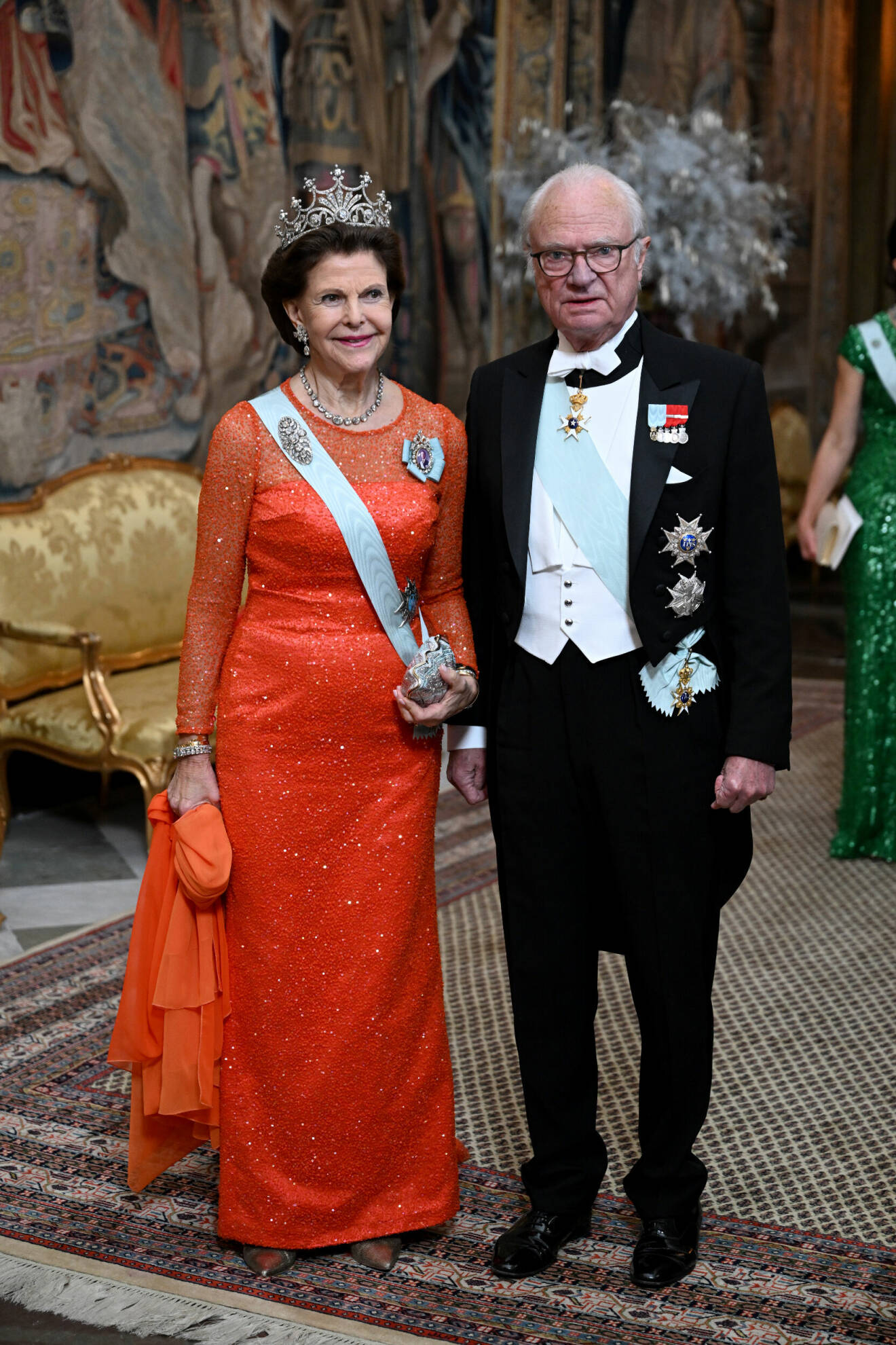 Drottning Silvia och kung Carl Gustaf vid Kungens middag för Nobelpristagarna på Stockholms slott.
