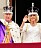 Kung Charles och drotting Camilla nykrönta på slottsbalkongen i sina kronor