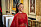 Prinsessan Isabella i en röd klänning under firandet av drottning Margrethe 50 år på tronen